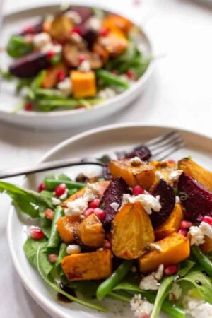 Golden and red beets roasted and served with arugula and goat cheese.