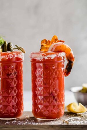 Bloody mary bar with shrimp and bacon for garnish.