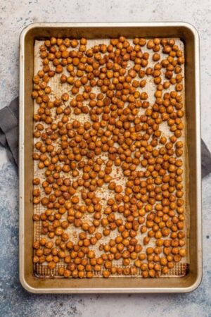 Roasted chickpeas on a baking sheet.