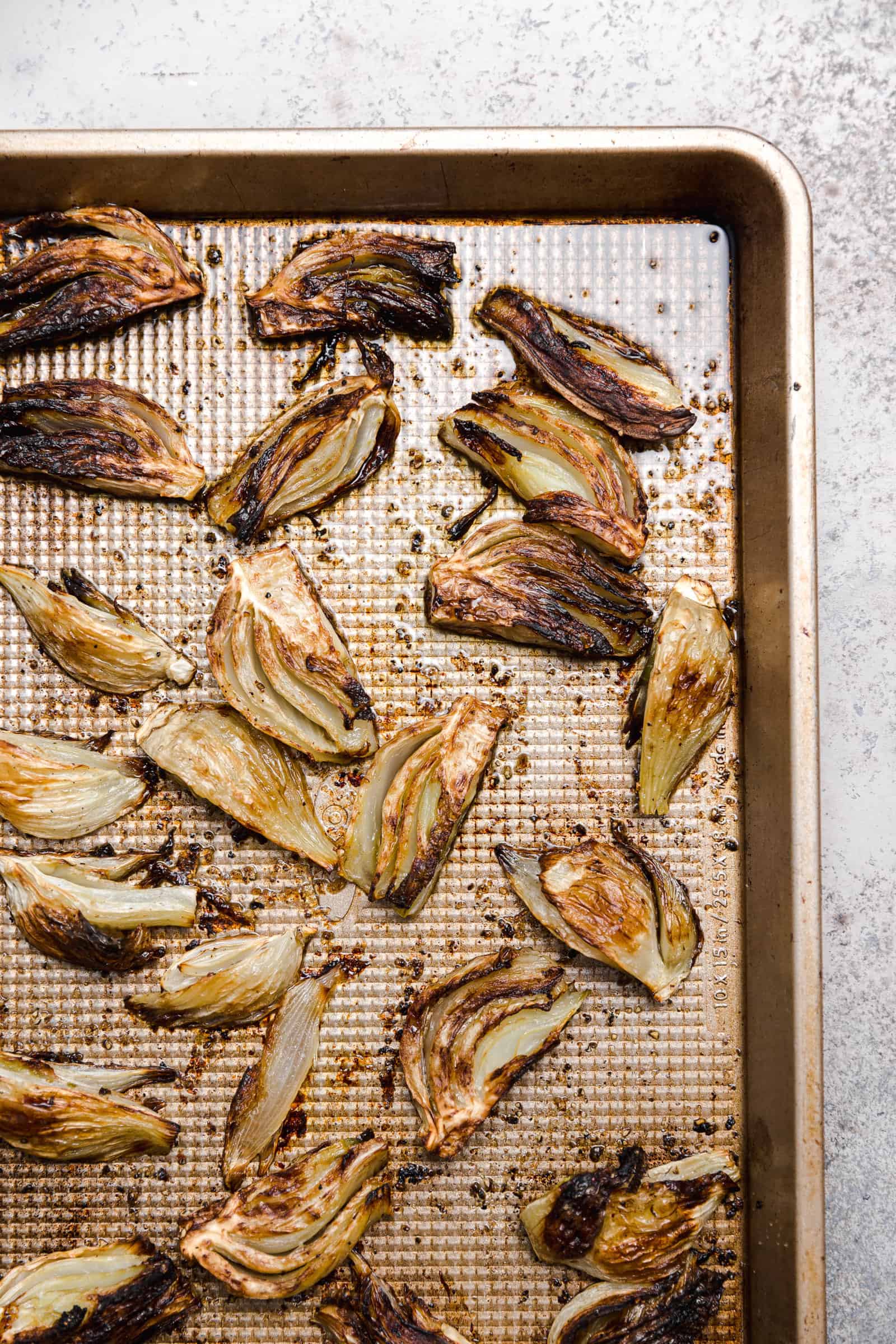 roasted fennel on a rimmed baking sheet