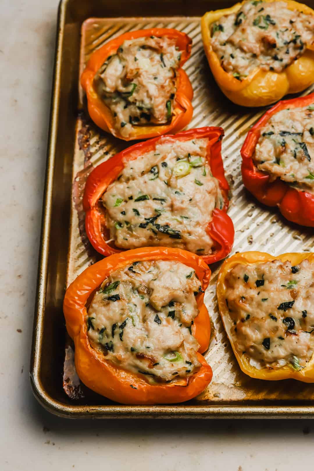 Baked Asian stuffed peppers on a baking sheet