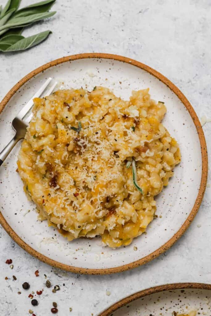 Parmesan risotto with black pepper on a plate.