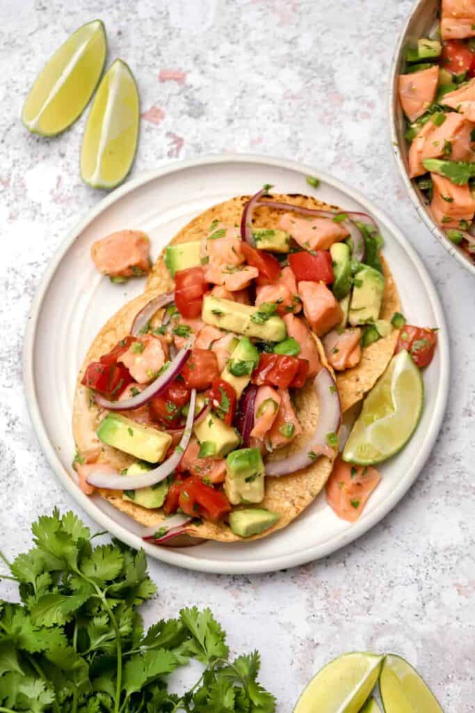 Fish ceviche with avocados on tostadas.