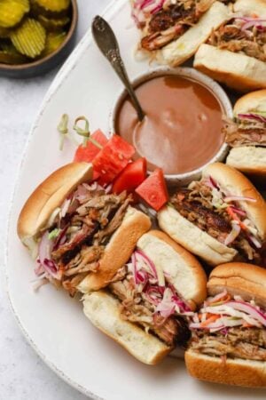 Pulled pork with Carolina gold bbq sauce on a tray.