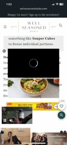 A screenshot of the Well Seasoned Studio website on a mobile device. The site displays a green chicken chili soup recipe page, with text, a loading video overlay, and an image of a herb-garnished bowl. Ads are visible at the bottom.
