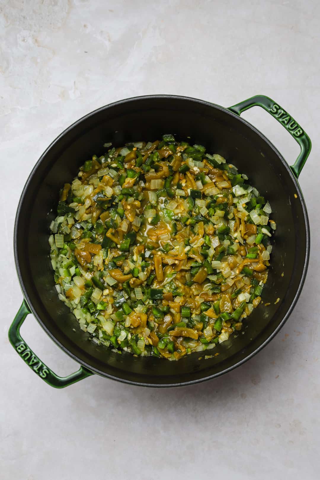 Diced green chilies added to the vegetables.