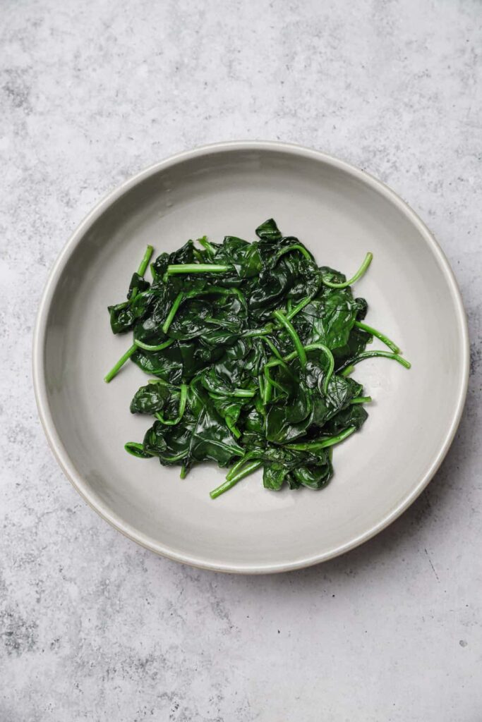Sautéed fresh baby spinach in a bowl