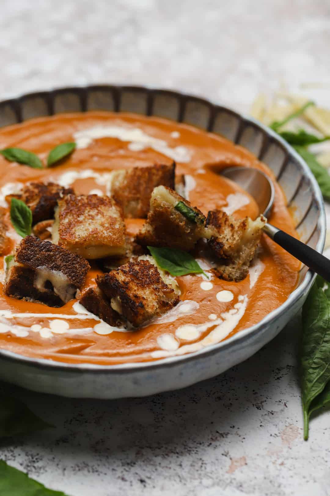 Grilled cheese and tomato soup in a bowl.