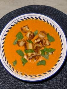 Roasted tomato soup with grilled cheese croutons and fresh basil.