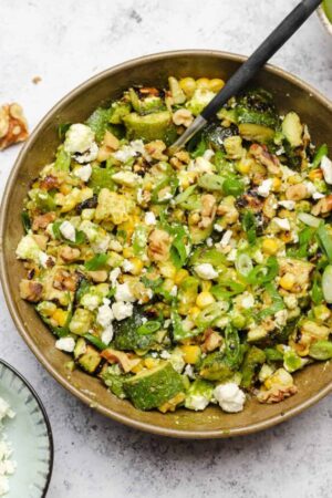 Grilled corn and zucchini salad with feta cheese and basil vinaigrette.