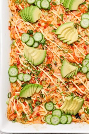 Close of up sushi bake with spicy kani salad and spicy mayo.