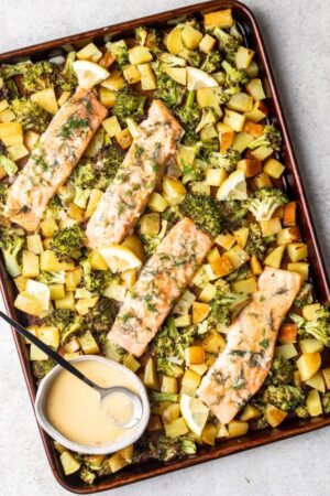 Sheet pan salmon with broccoli potatoes and citrus beurre blanc.