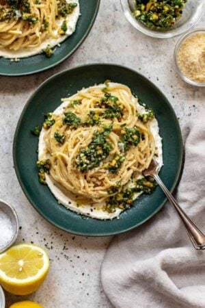 Lemon ricotta pasta in a bowl with gremolata on top.
