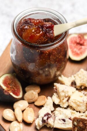 Homemade fig preserves on a cheese plate.