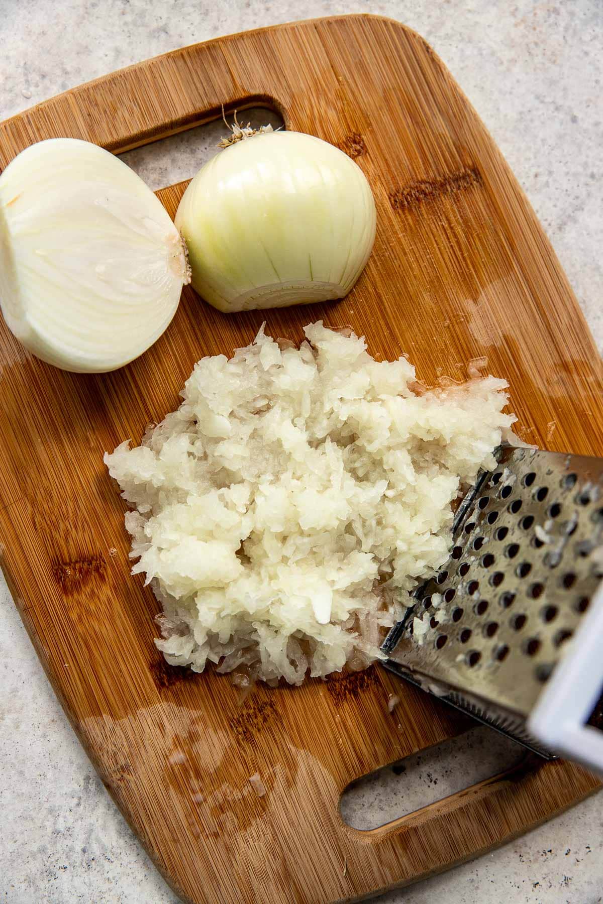 Grating onion for potato latkes.