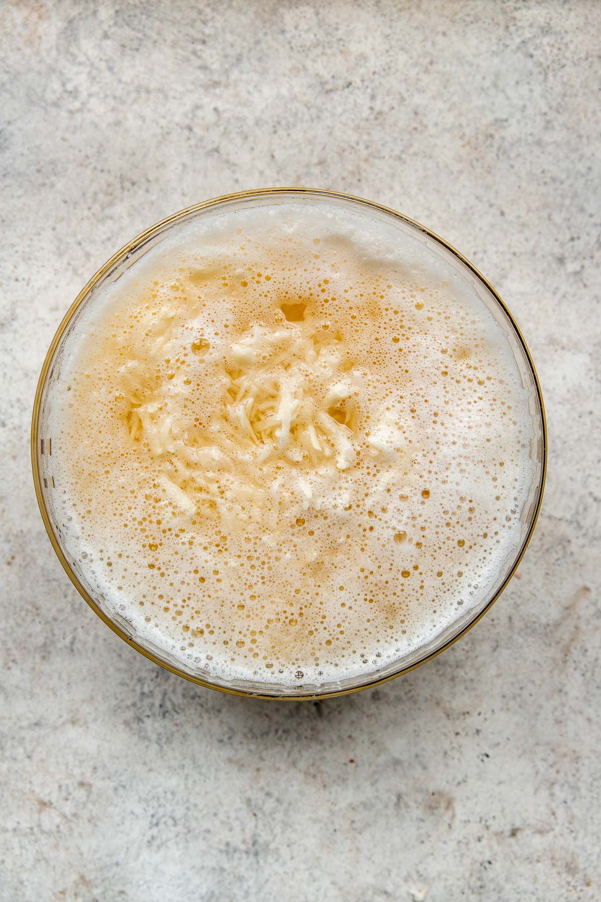 Soaking grated potatoes in water.