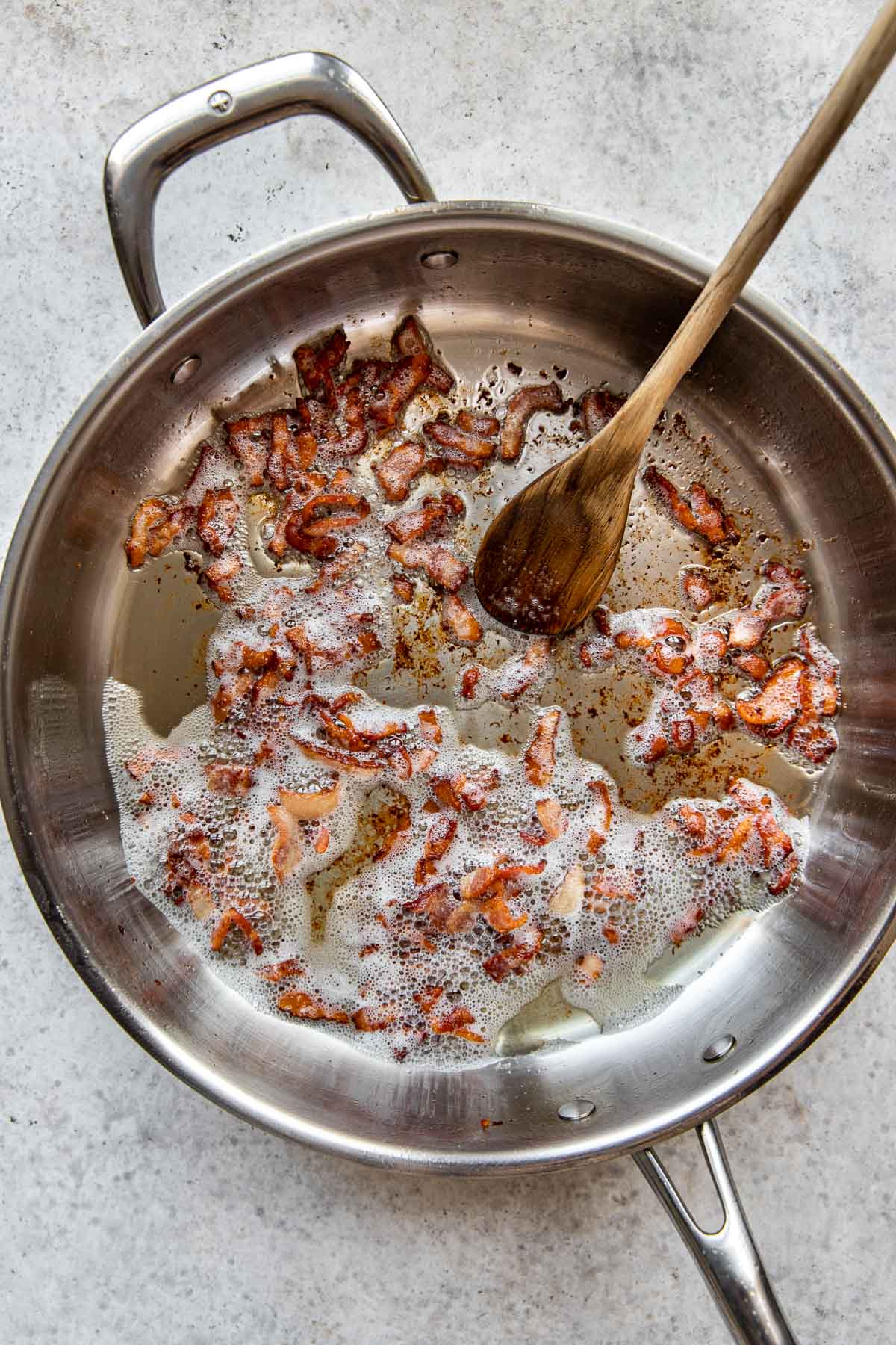 Cooking bacon in a skillet.