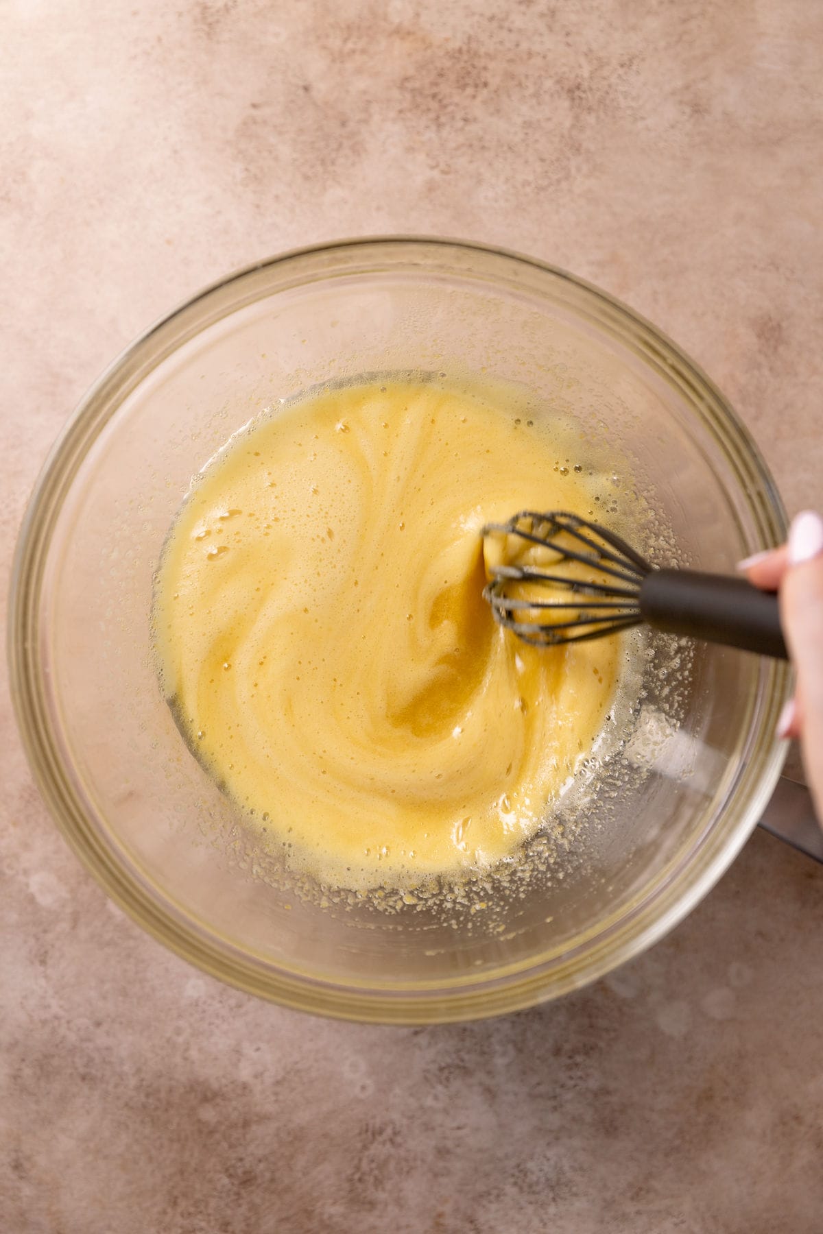 Homemade zabaglione in a mixing bowl.