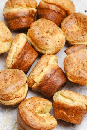 A dozen popovers with gruyere cheese and black pepper.