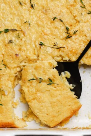 Grabbing a spoonful of corn pudding.