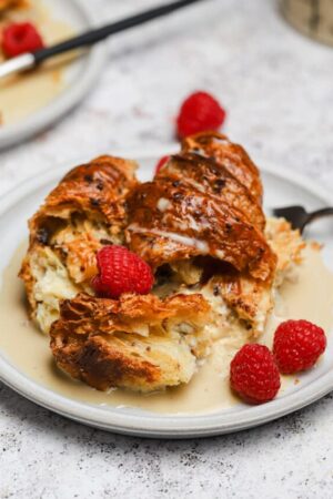 Crispy bread pudding with espresso creme anglaise and fresh fruit.