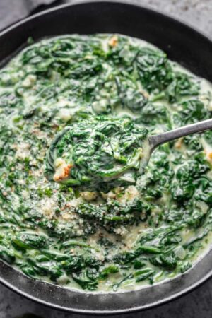 Spoonful of creamy gruyere spinach.