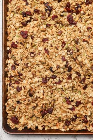 Eleven Madison Park granola recipe cooling on a sheet pan.