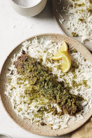 Herb and macadamia crusted salmon over white rice.