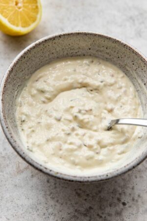Tartar sauce in a bowl with a spoon.