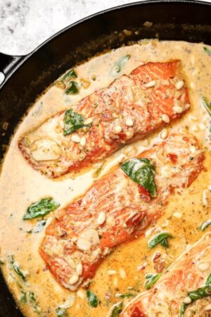 Pan seared trout with creamy Tuscan sauce.