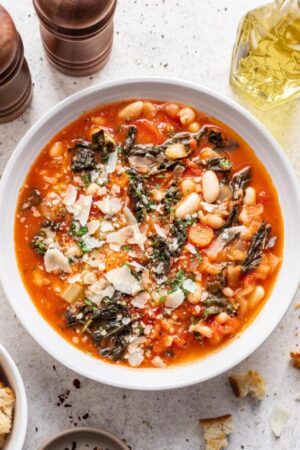 Tuscan ribollita soup with parmesan cheese in a bowl.