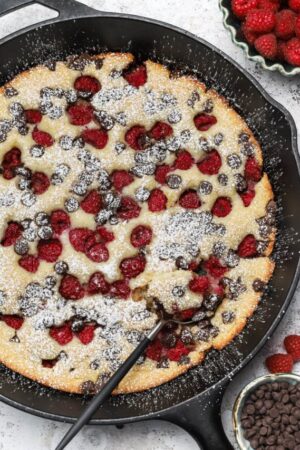Spoonful of raspberry and chocolate chip cobbler.
