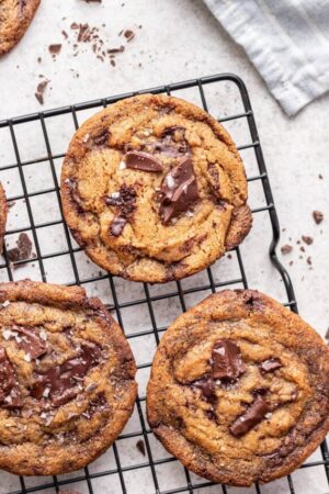 Miso chocolate chip cookies cooling on a wire rack.