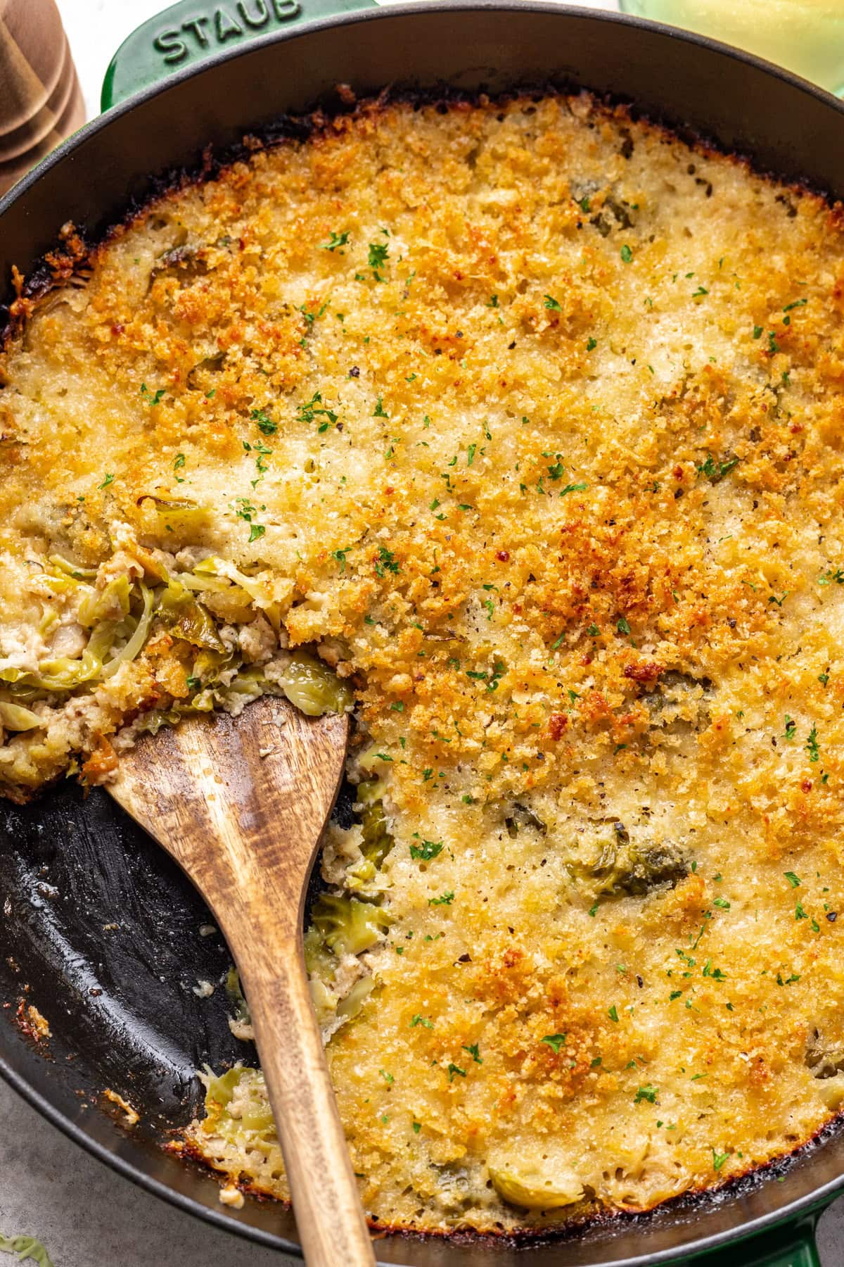 Creamy Brussels sprouts gratin in a skillet.