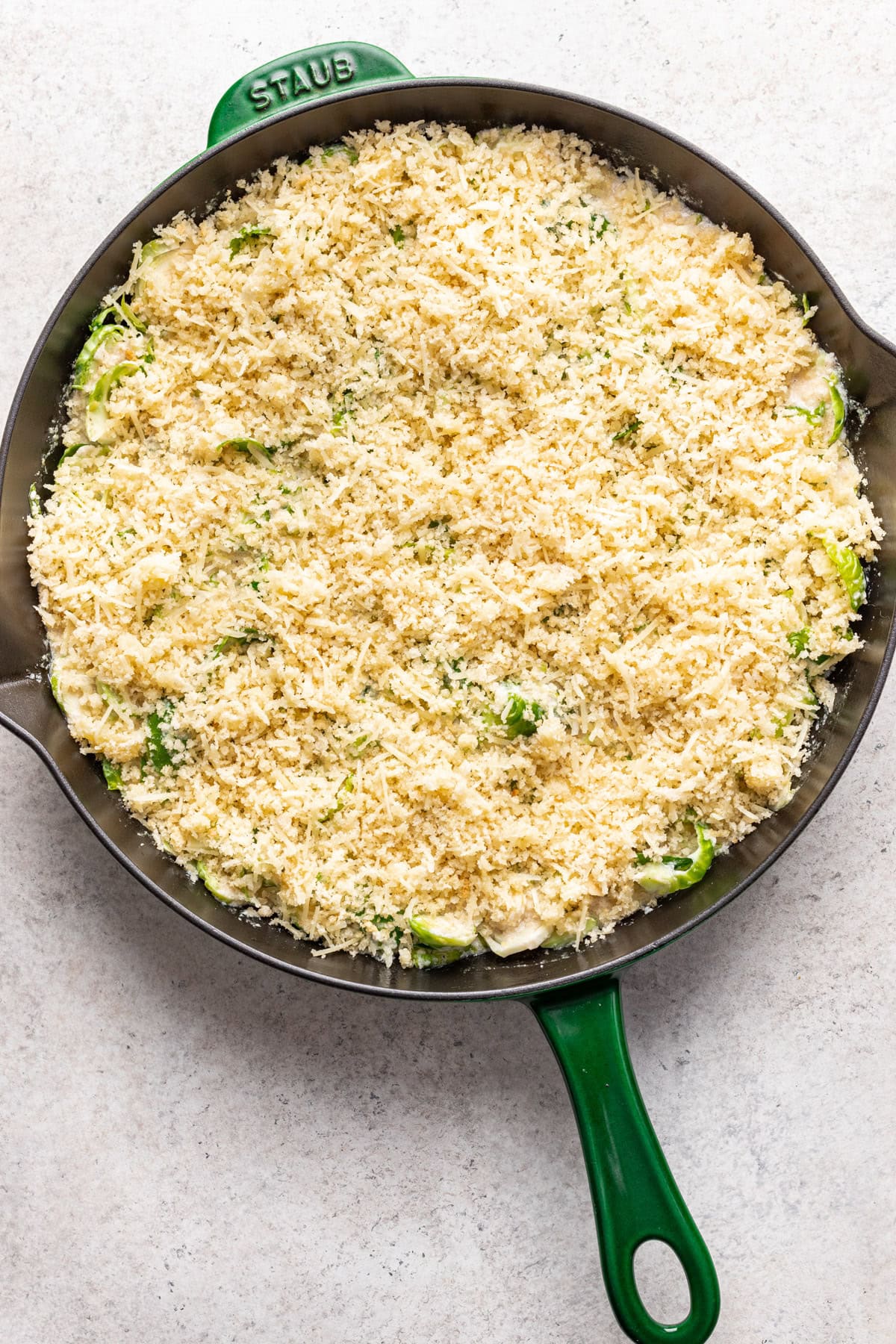 Sprinkle the panko breadcrumbs on top of the brussels sprouts.