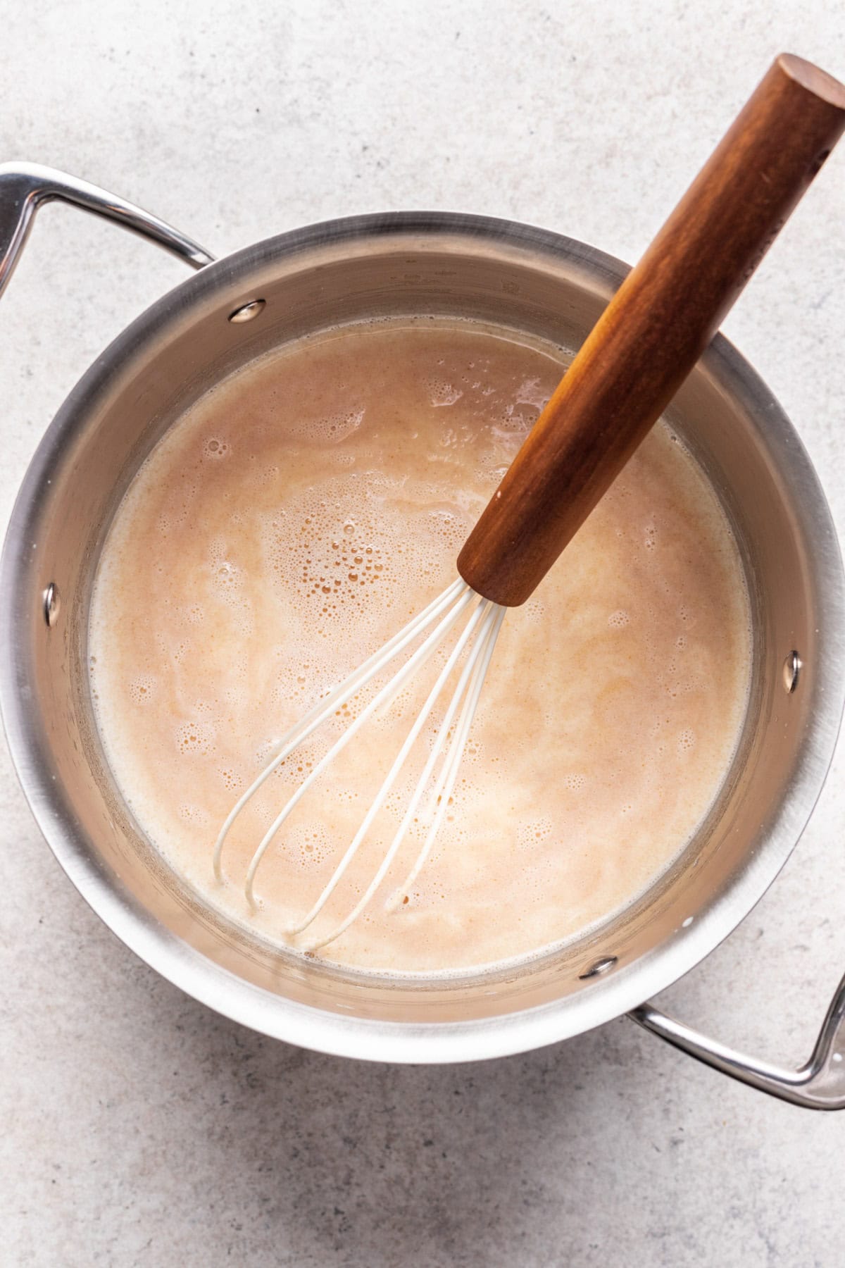 Whisk flour into melted brown butter.
