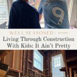 Two children look out a window at construction equipment as their home is transformed. Below, exposed beams and tools show the reality of living through construction with kids—text reads, “Living Through Construction With Kids: It Ain’t Pretty.”.